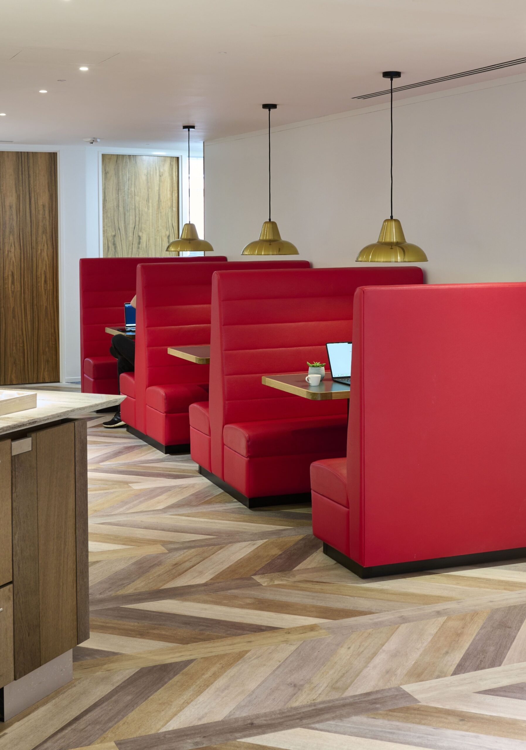 Comfortable booth seating at Beaumont Midtown providing a welcoming setting for collaboration, networking and focused work.