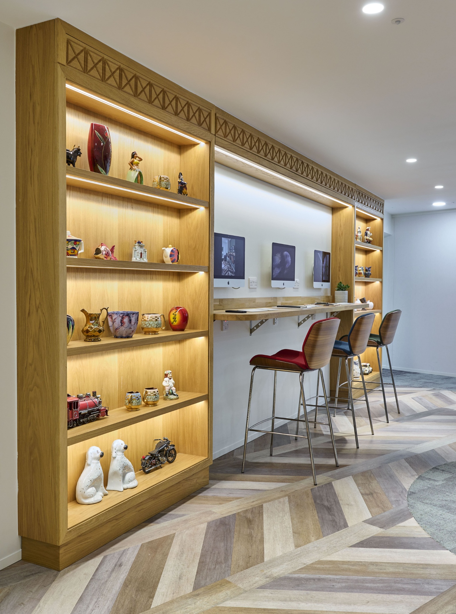 Dedicated refreshment area at Beaumont Midtown offering complimentary snacks and drinks within a modern business lounge environment.