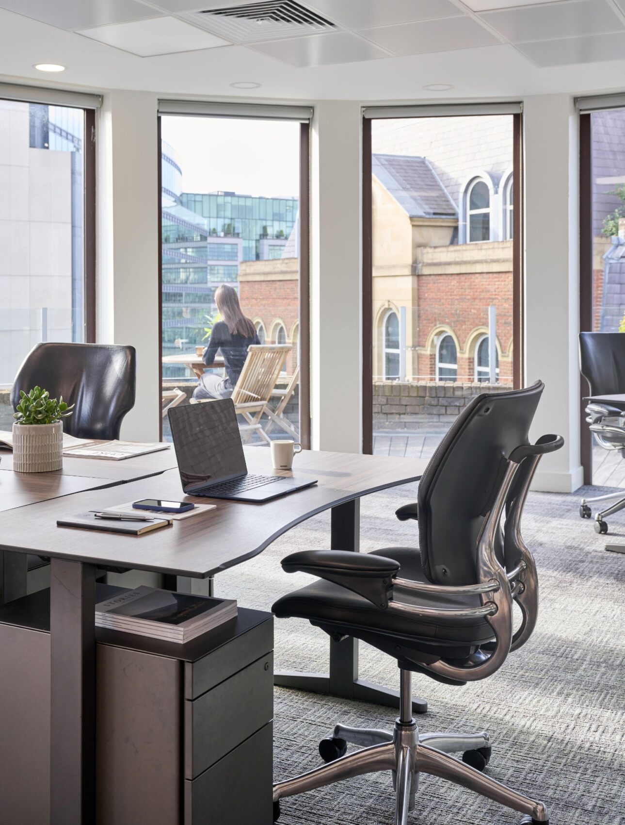 Bright private office at Beaumont Snowhill with ergonomic workstations, natural light and city views.