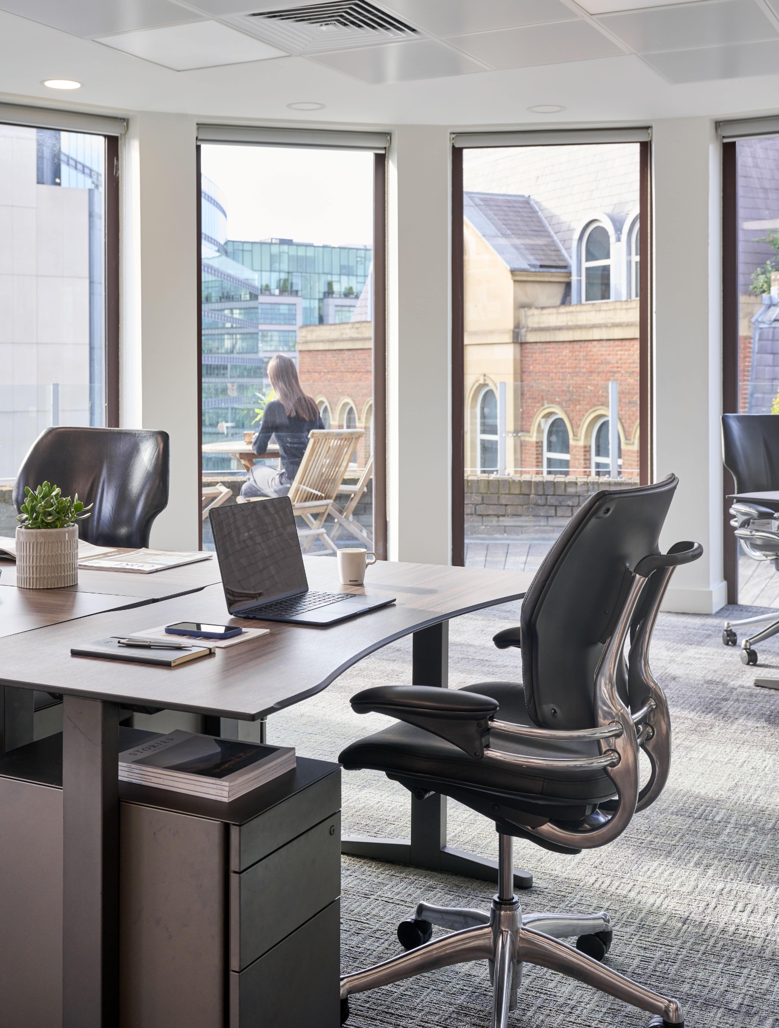 Bright private office at Beaumont Snowhill with ergonomic workstations, natural light and city views.